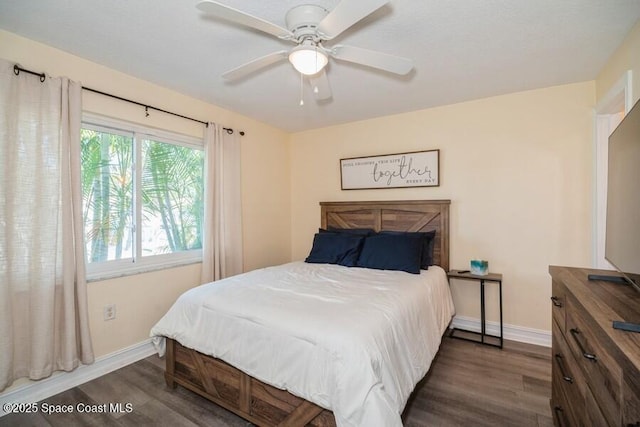 2160 Emerald Ct, Merritt Island, FL 32953 - bedroom with dark wood finished floors, baseboards, and a ceiling fan