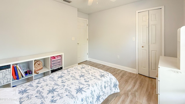 544 Plumbago Rd NW, Palm Bay, FL 32907 - bedroom featuring light wood finished floors, baseboards, a ceiling fan, and arched walkways