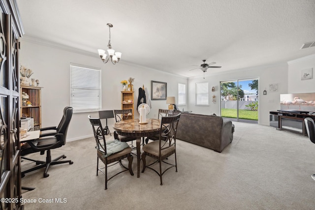 1662 Orsi Pl, West Melbourne, FL 32904 - dining room featuring crown molding, light carpet, ceiling fan, and a chandelier