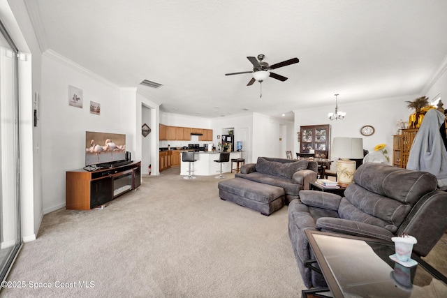 1662 Orsi Pl, West Melbourne, FL 32904 - living area with ceiling fan, crown molding, a chandelier, and light carpet