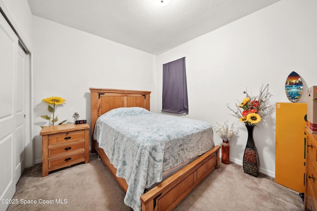 1662 Orsi Pl, West Melbourne, FL 32904 - bedroom with light colored carpet, a closet, and a textured ceiling