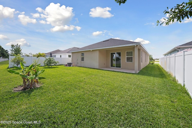 1662 Orsi Pl, West Melbourne, FL 32904 - back of house featuring stucco siding and a patio