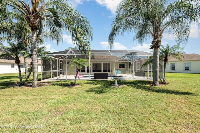 1536 Grand Isle Blvd, Melbourne, FL 32940 - back of property featuring a yard, an outdoor pool, a patio, and glass enclosure