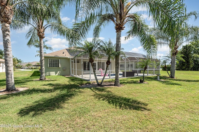 1536 Grand Isle Blvd, Melbourne, FL 32940 - back of property with stucco siding, a yard, a patio, a lanai, and an outdoor pool