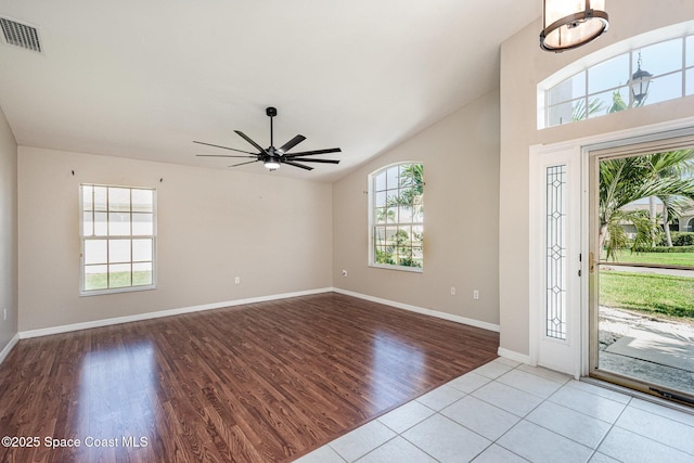 1536 Grand Isle Blvd, Melbourne, FL 32940 - foyer entrance with healthy amount of natural light, wood finished floors, lofted ceiling, ceiling fan, and baseboards