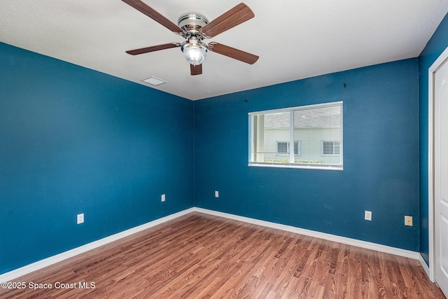 1536 Grand Isle Blvd, Melbourne, FL 32940 - empty room featuring wood finished floors, ceiling fan, and baseboards