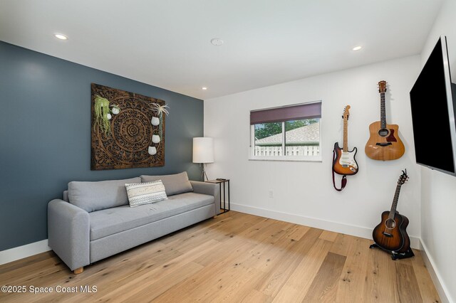 3204 Nottingham Ln, Cocoa, FL 32926 - living room with light wood-style flooring, recessed lighting, and baseboards