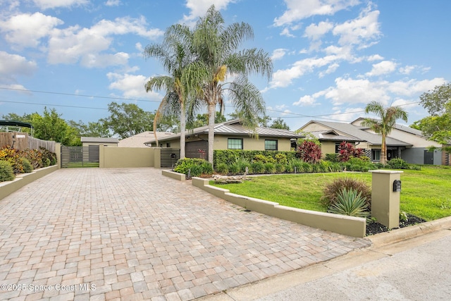3204 Nottingham Ln, Cocoa, FL 32926 - single story home with a gate, driveway, and stucco siding