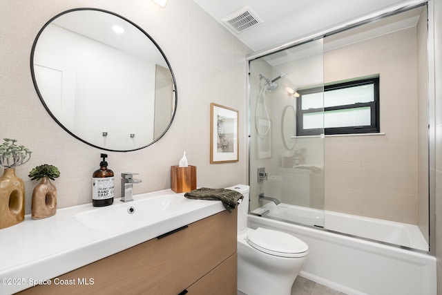 3204 Nottingham Ln, Cocoa, FL 32926 - bathroom featuring toilet, vanity, and bath / shower combo with glass door