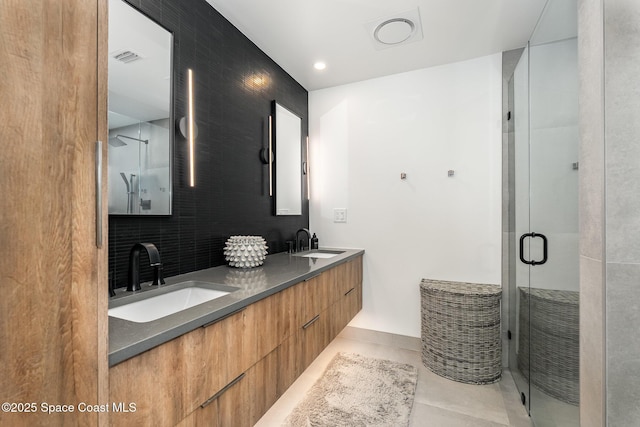 3204 Nottingham Ln, Cocoa, FL 32926 - bathroom featuring a shower stall, tile patterned floors, double vanity, and backsplash
