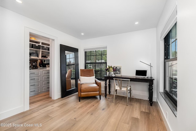 3204 Nottingham Ln, Cocoa, FL 32926 - living area with wood finished floors, recessed lighting, a desk, and baseboards