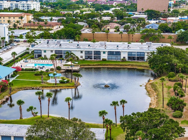 3165 N Atlantic Ave Unit C206, Cocoa Beach, FL 32931 - drone / aerial view of a large body of water and a pool area
