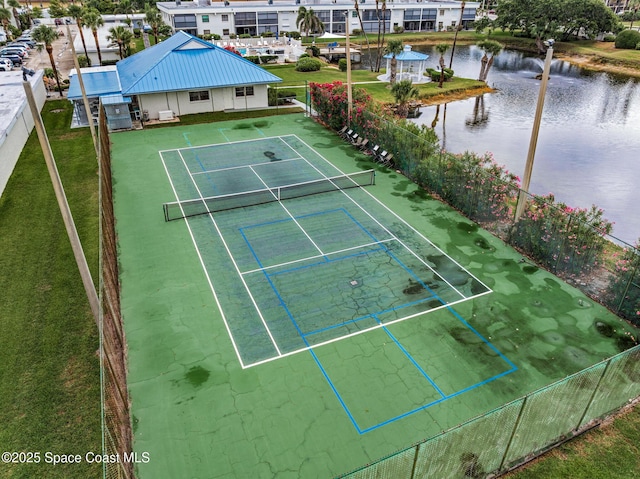 3165 N Atlantic Ave Unit C206, Cocoa Beach, FL 32931 - view of tennis court featuring fence and a water view