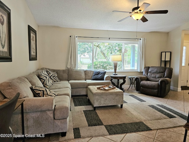 6630 Cecil Rd, Cocoa, FL 32927 - living room with a textured ceiling, a ceiling fan, and tile patterned floors