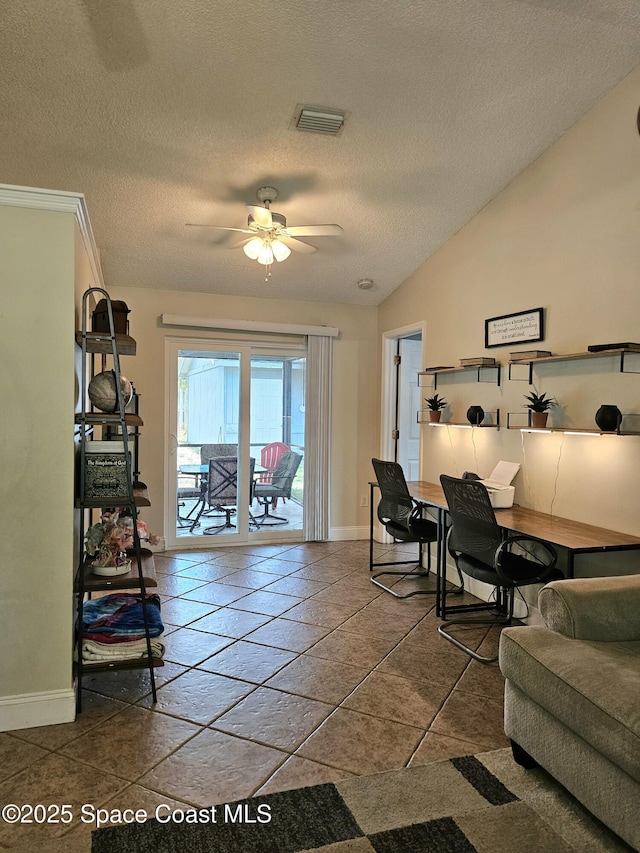 6630 Cecil Rd, Cocoa, FL 32927 - tiled living room featuring a textured ceiling, a ceiling fan, a desk, and lofted ceiling