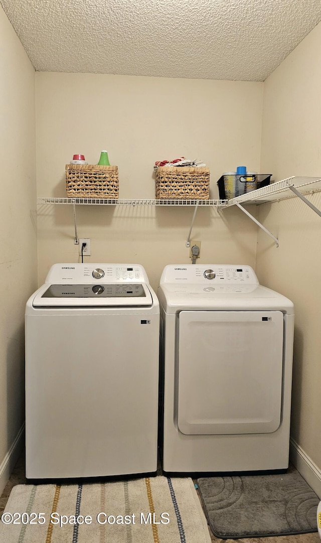 6630 Cecil Rd, Cocoa, FL 32927 - laundry room with independent washer and dryer and a textured ceiling