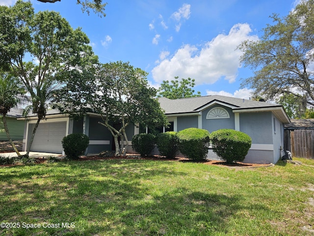 6630 Cecil Rd, Cocoa, FL 32927 - ranch-style house with an attached garage, a front lawn, and stucco siding