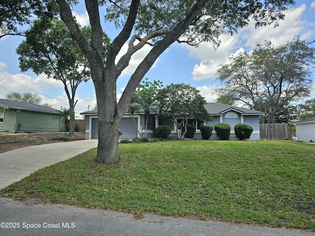 6630 Cecil Rd, Cocoa, FL 32927 - view of front of home with driveway and a garage