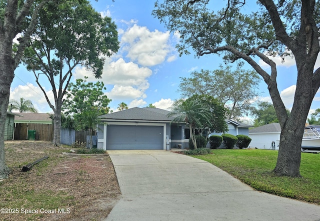 6630 Cecil Rd, Cocoa, FL 32927 - single story home featuring driveway, a garage, and stucco siding