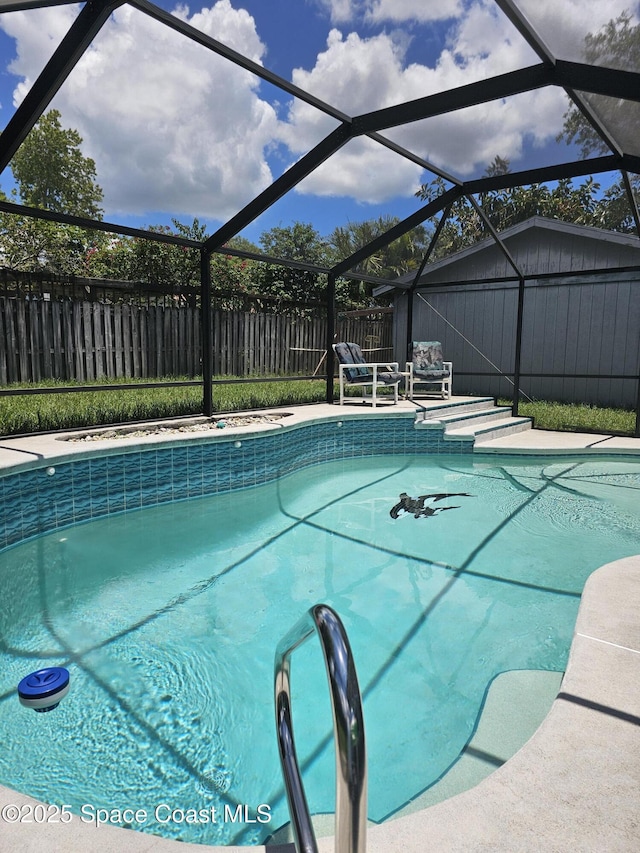 6630 Cecil Rd, Cocoa, FL 32927 - view of swimming pool with a fenced backyard and glass enclosure