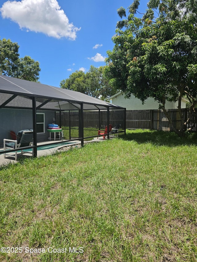 6630 Cecil Rd, Cocoa, FL 32927 - fenced backyard with a lanai