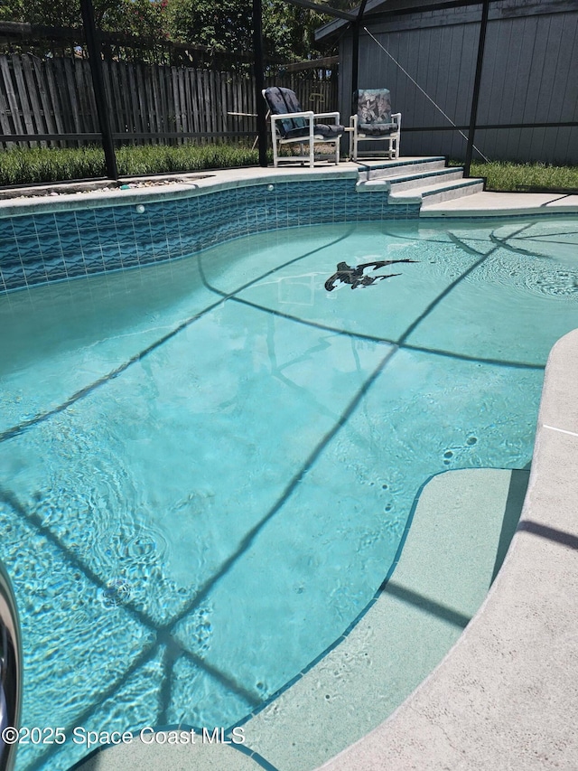 6630 Cecil Rd, Cocoa, FL 32927 - view of swimming pool featuring glass enclosure