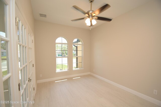 unfurnished room with light wood-type flooring, baseboards, and ceiling fan