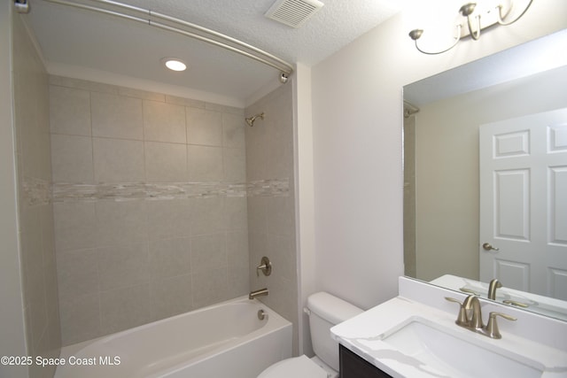 bathroom with shower / tub combination, toilet, vanity, a textured ceiling, and recessed lighting