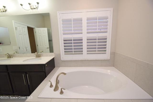 bathroom with a garden tub and double vanity