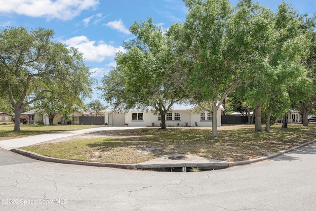view of front of property with concrete driveway and a garage