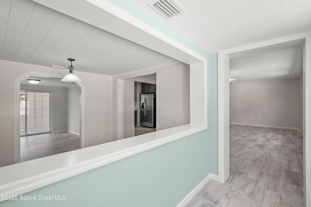 hallway featuring baseboards