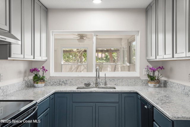 kitchen with a sink, black dishwasher, ceiling fan, and blue cabinets