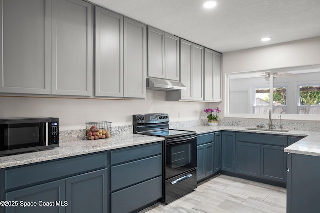 kitchen featuring electric range, a sink, under cabinet range hood, recessed lighting, and ceiling fan