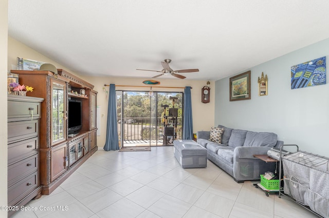 living area featuring a ceiling fan and light tile patterned flooring