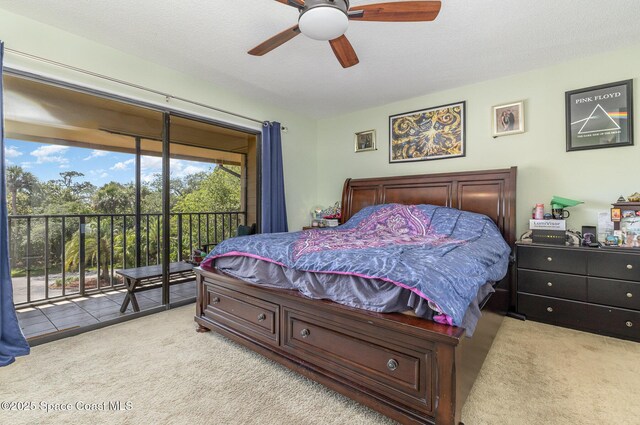 carpeted bedroom featuring access to exterior and ceiling fan