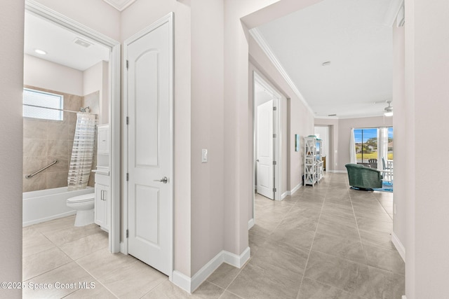 2162 Great Belt Cir, Melbourne, FL 32940 - hall featuring crown molding, baseboards, and light tile patterned floors