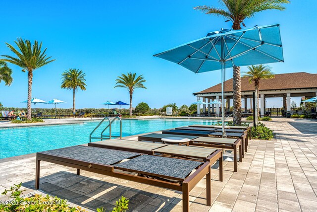 2162 Great Belt Cir, Melbourne, FL 32940 - community pool featuring a patio area