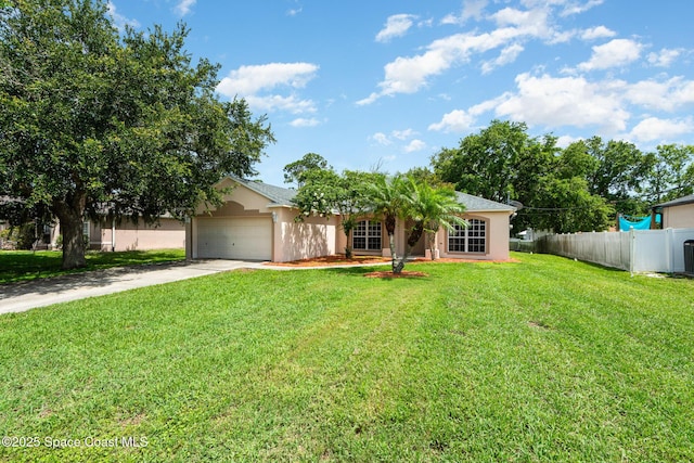 4465 Everglades St, Cocoa, FL 32927 - view of front of home with stucco siding, concrete driveway, and a garage