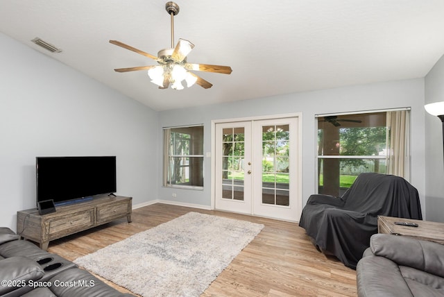 4465 Everglades St, Cocoa, FL 32927 - living room featuring ceiling fan, french doors, light wood-style flooring, vaulted ceiling, and baseboards