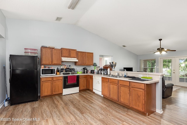 4465 Everglades St, Cocoa, FL 32927 - kitchen with electric stove, freestanding refrigerator, dishwasher, a peninsula, and under cabinet range hood