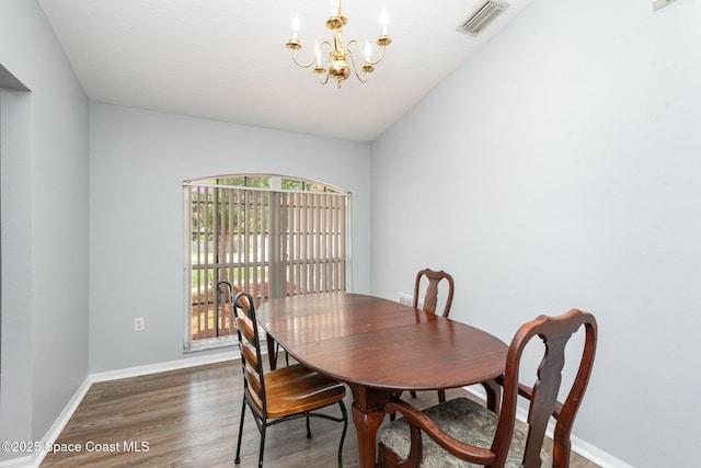 4465 Everglades St, Cocoa, FL 32927 - dining space featuring wood finished floors, a chandelier, and baseboards