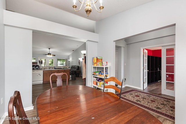 4465 Everglades St, Cocoa, FL 32927 - dining space with wood finished floors, a chandelier, baseboards, lofted ceiling, and a ceiling fan