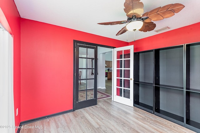 4465 Everglades St, Cocoa, FL 32927 - unfurnished room featuring french doors, wood finished floors, and ceiling fan