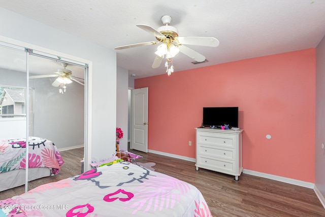 4465 Everglades St, Cocoa, FL 32927 - bedroom with wood finished floors, a closet, baseboards, and a ceiling fan