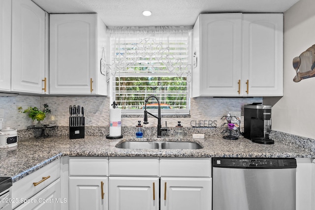261 Cape Shores Cir Unit 18-E, Cape Canaveral, FL 32920 - kitchen featuring dishwasher, a sink, white cabinets, and tasteful backsplash