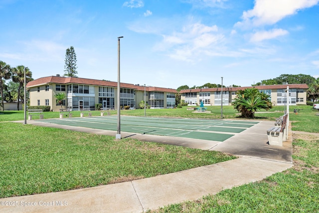 261 Cape Shores Cir Unit 18-E, Cape Canaveral, FL 32920 - view of home's community with a yard and shuffleboard