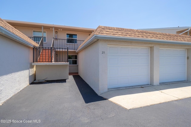 7201 Ridgewood Ave Unit 23, Cape Canaveral, FL 32920 - view of front of home with stucco siding and roof with shingles