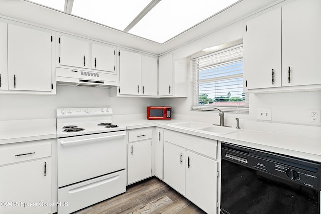 7201 Ridgewood Ave Unit 23, Cape Canaveral, FL 32920 - kitchen with dishwasher, under cabinet range hood, white range with electric cooktop, a sink, and light countertops