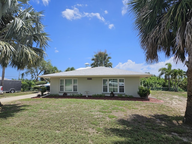 7181 Blue Shore Rd, Grant, FL 32949 - view of front of property featuring stucco siding and a front yard