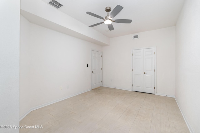 unfurnished bedroom with baseboards and ceiling fan